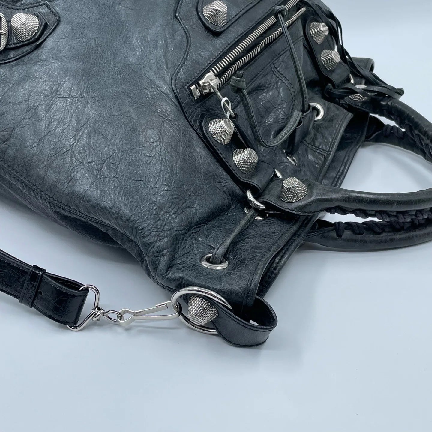 Luxury Pre-Owned Designer Leather Bucket Bag with Chic Metal Studs and Adjustable Shoulder Strap