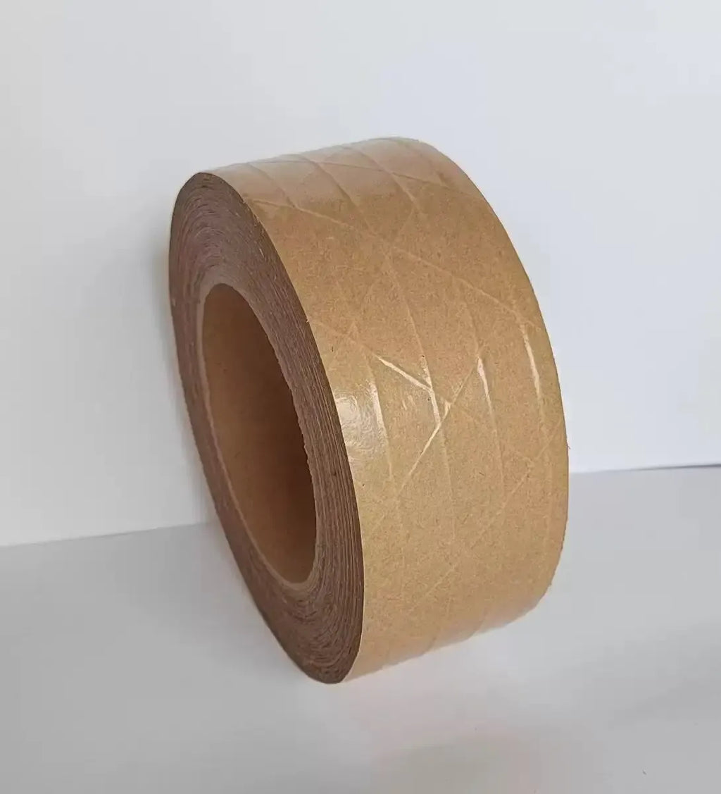 Brown kraft packing tape roll on a plain background