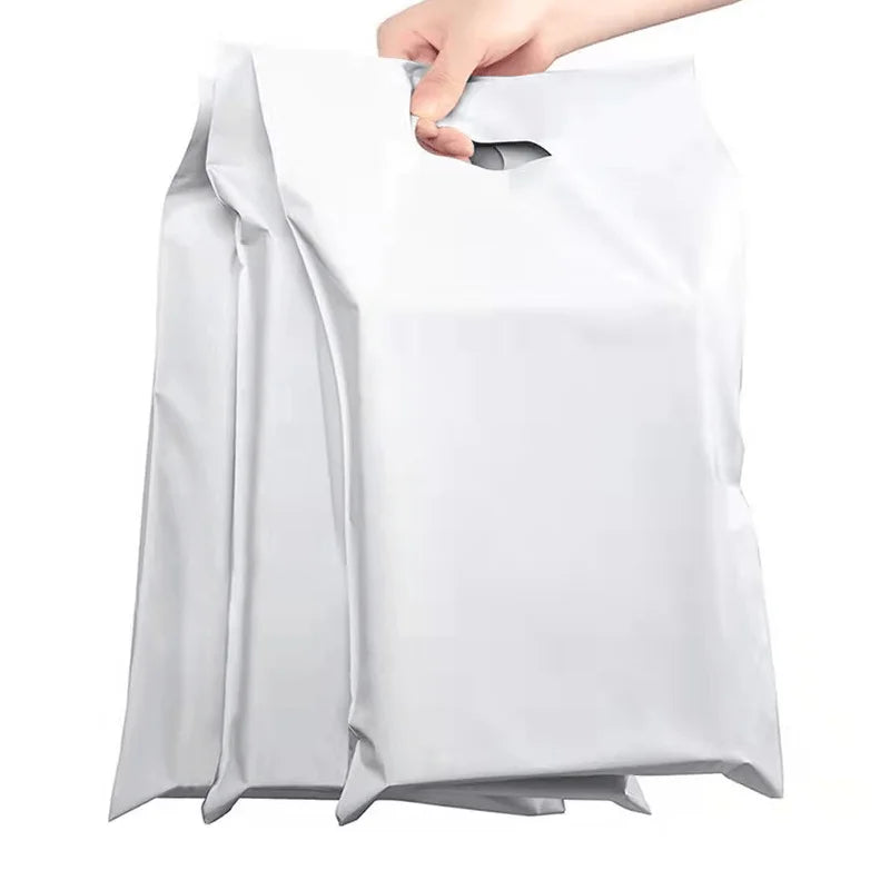 White plastic poly mailer bag with fold-over self-seal flap and handle cutout