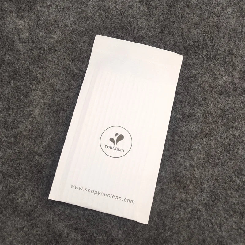 White padded paper mailer bag with YouClean logo and website text