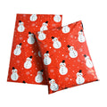 Red Christmas poly mailers with white snowman and snowflake prints