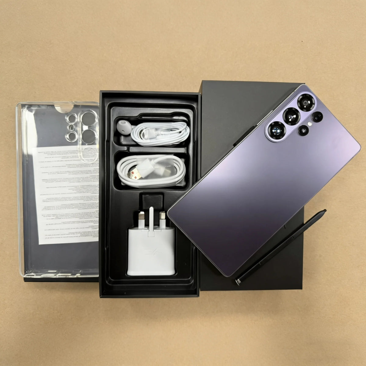 Purple smartphone with quad rear cameras, shown with open box and charging cable