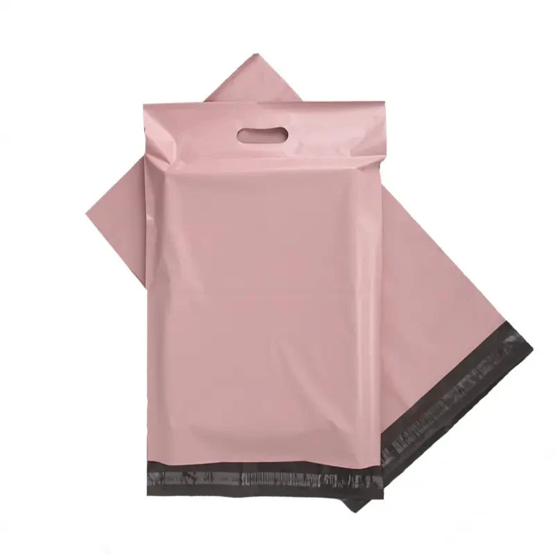 Pink plastic poly mailer shipping bag with built-in handle and double-seal edge.