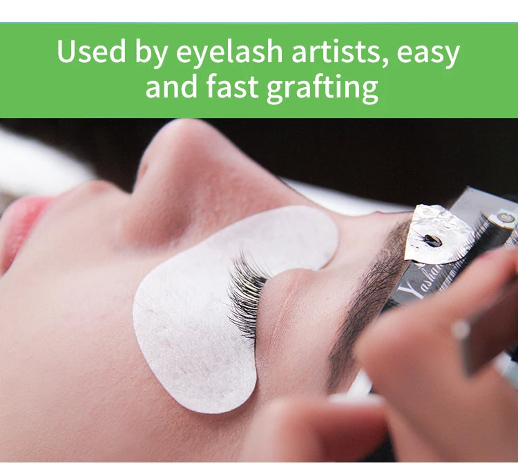 Close-up of a technician applying natural-looking, soft black 5D W-style volume eyelash extensions to a client.