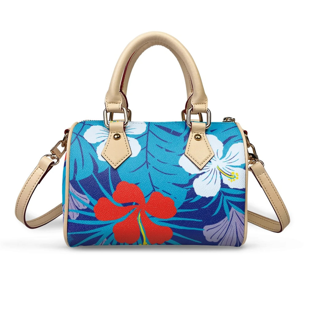 Blue tropical floral print waterproof PU leather trunk handbag with beige handles and removable cross-body strap.