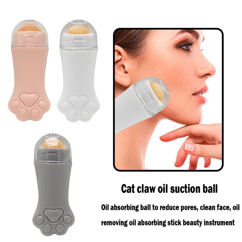 Three cat-paw-shaped volcanic stone facial oil rollers in pink, white, and grey, shown in use on a person's face.