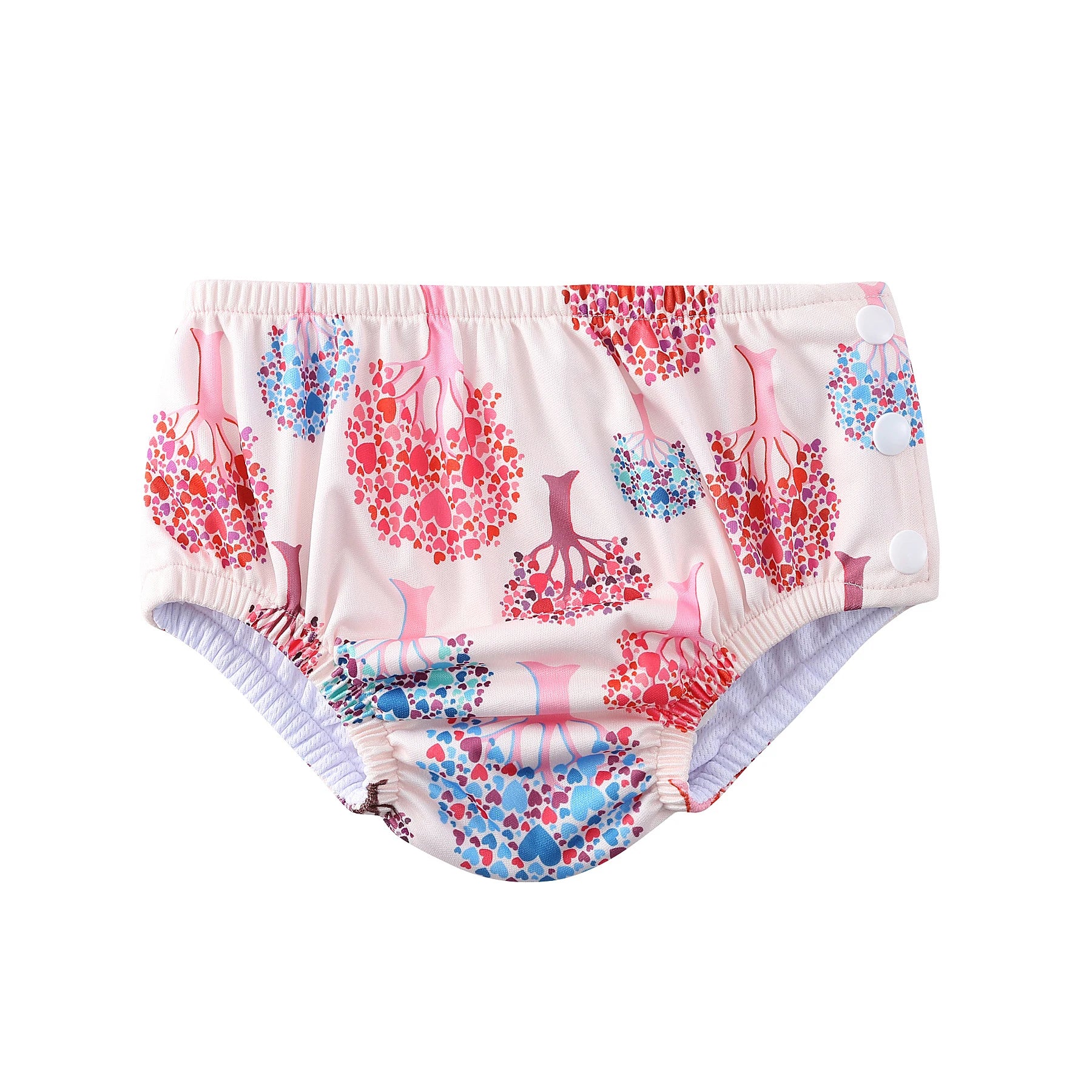 Reusable cloth swim diaper with pink heart tree print and side snap buttons for baby care.