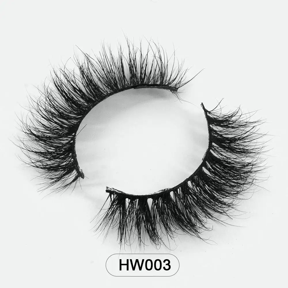 Pair of fluffy black 3D mink false eyelashes with a flexible band on a white background, model HW003.