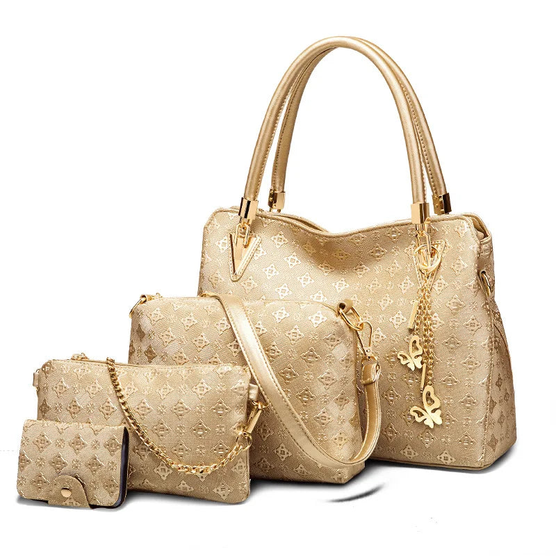 4-piece metallic gold handbag set with butterfly charms, embossed pattern, top handles, and chain shoulder strap.