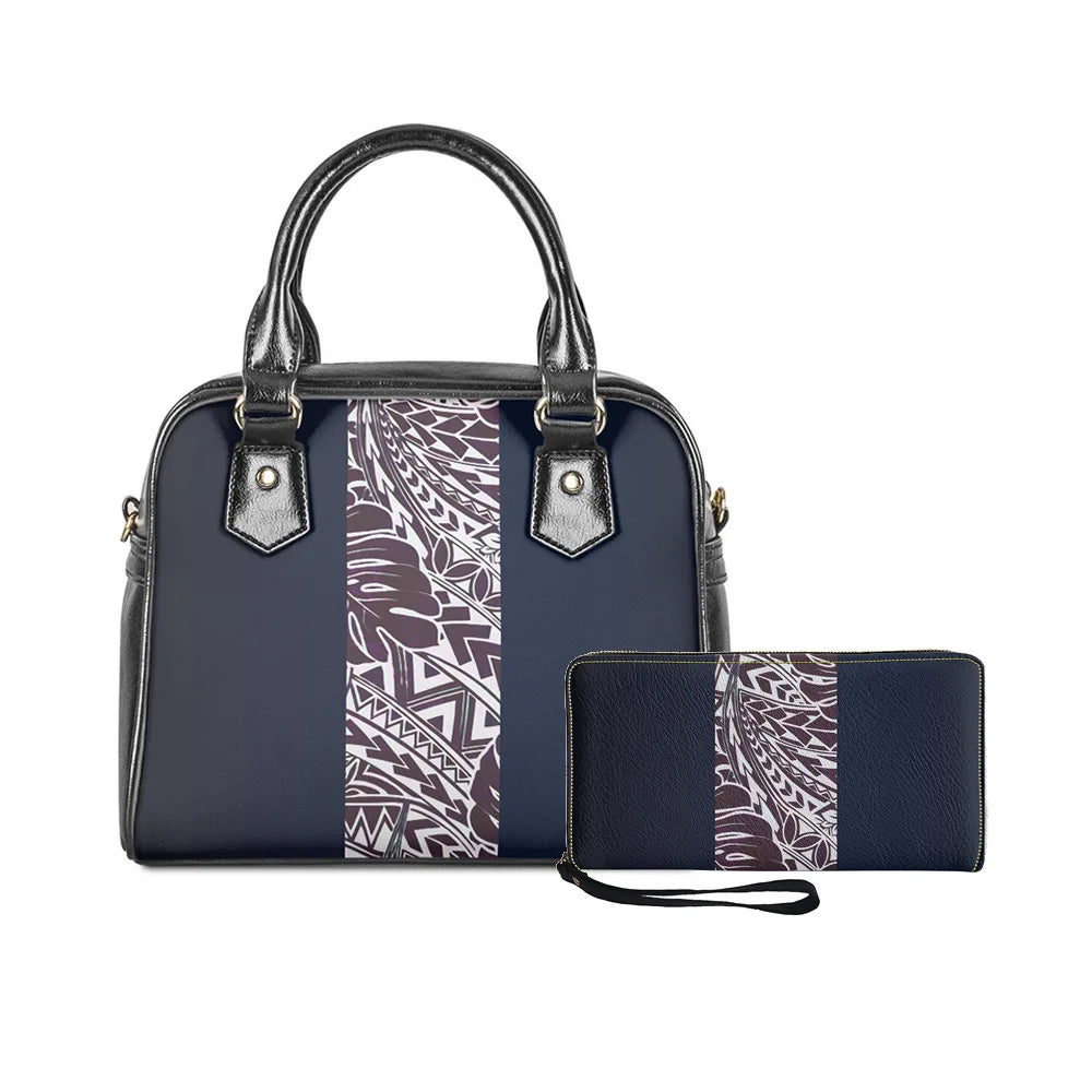 Navy blue 2-piece handbag set with Polynesian tribal monster leaf print, black leather trim, and matching wrist wallet.