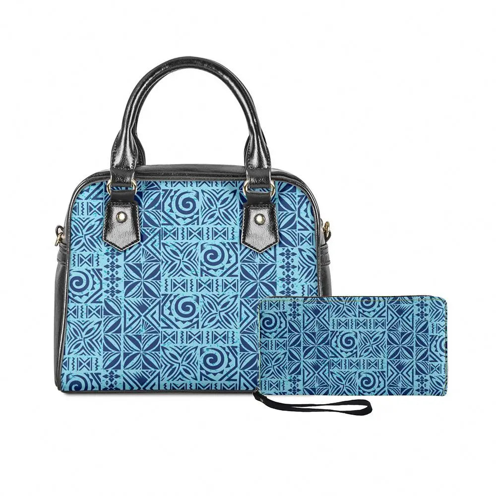 Two-piece blue Polynesian tribal print handbag set with matching wallet and black leather handles.