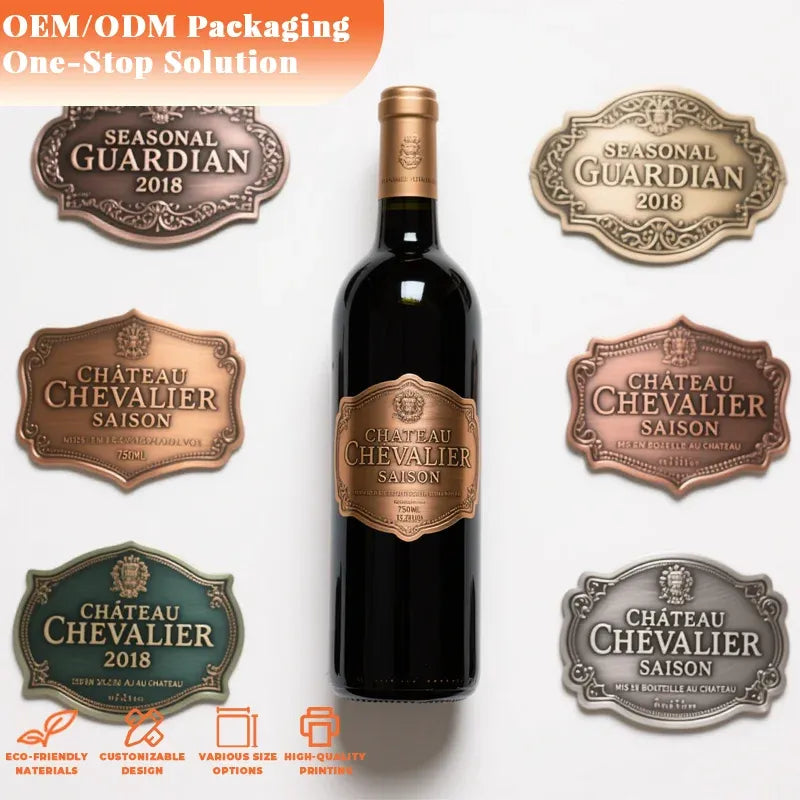 Embossed metal bottle labels in mixed finishes with sample wine bottle