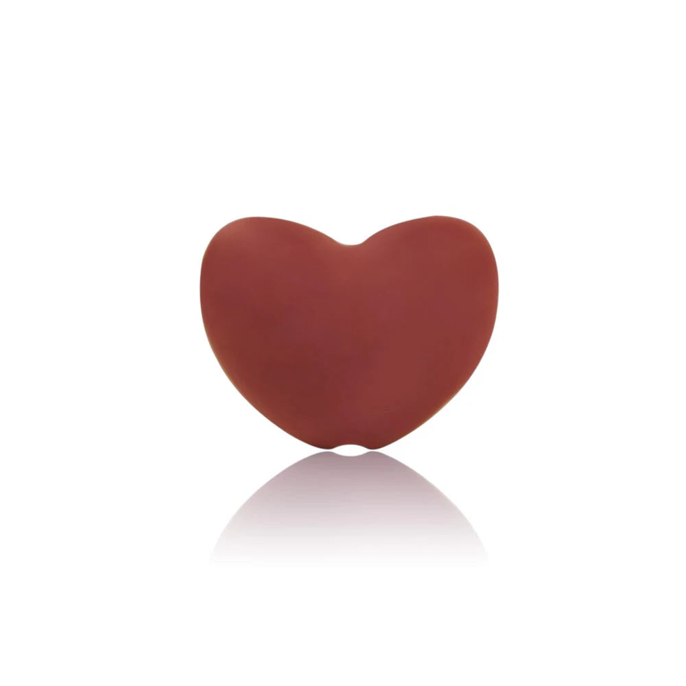 Red heart-shaped silicone baby teething toy for soothing gum pain.