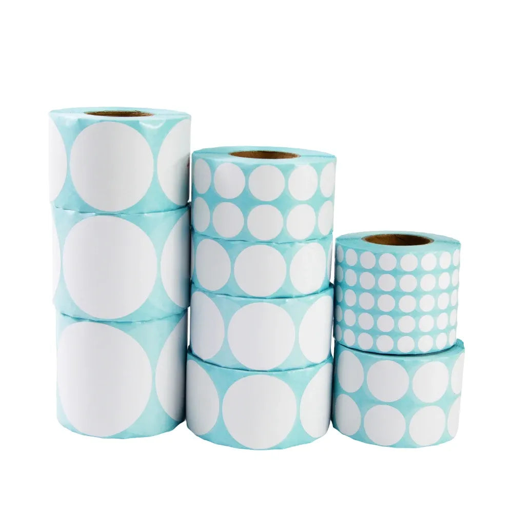 Three rolls of light blue thermal barcode labels with white circular print, adhesive