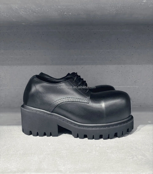 Black luxury leather lace-up platform shoes with chunky lug soles and rounded toe for women.