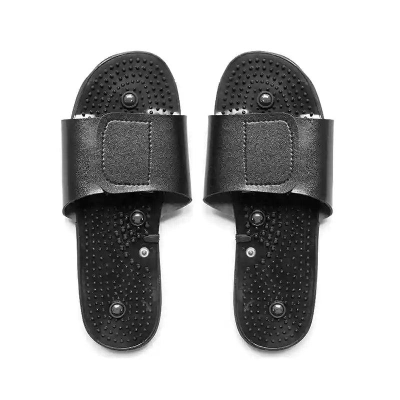 Black acupressure reflexology massage slippers with adjustable straps and textured sole for foot stress relief.
