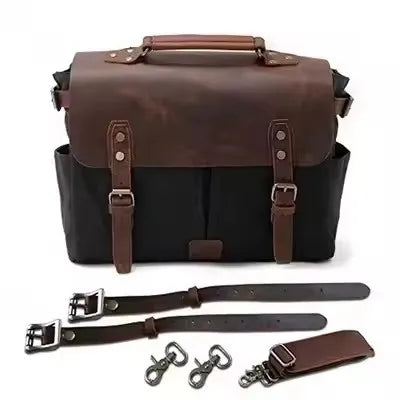 Retro motorcycle saddle bag in black oil wax canvas and brown crazy horse leather with straps and metal hardware.