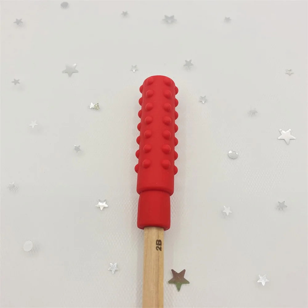 Red silicone teething toy pencil topper for baby teething relief.