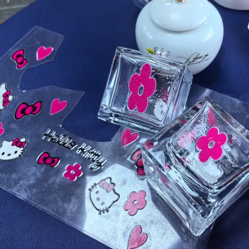 Vinyl die-cut sticker sheet with pink Hello Kitty heads, hearts, and flower icons