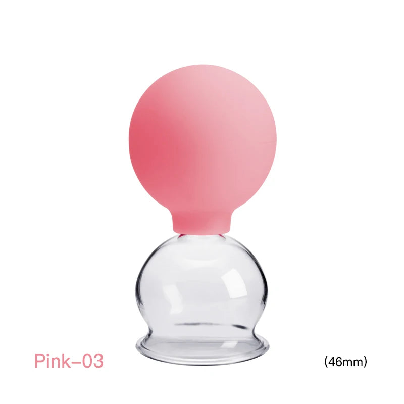 A 46mm pink silicone-topped glass vacuum cupping jar for facial and body massage therapy.