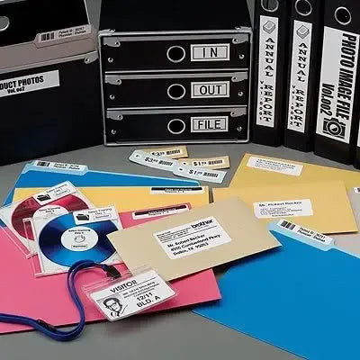 Mixed label pieces and rolled tapes with barcode and address layouts for QL printers