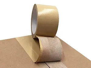 Light brown kraft paper tape rolls stacked on a flat surface