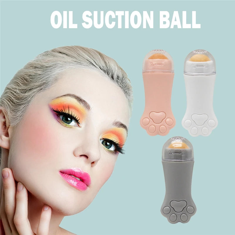Pink, white, and gray cat-paw-shaped volcanic stone oil-absorbing facial rollers with clear caps.