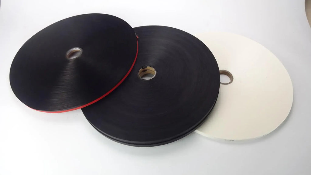 Thermal label tape rolls, black spools with paper cores