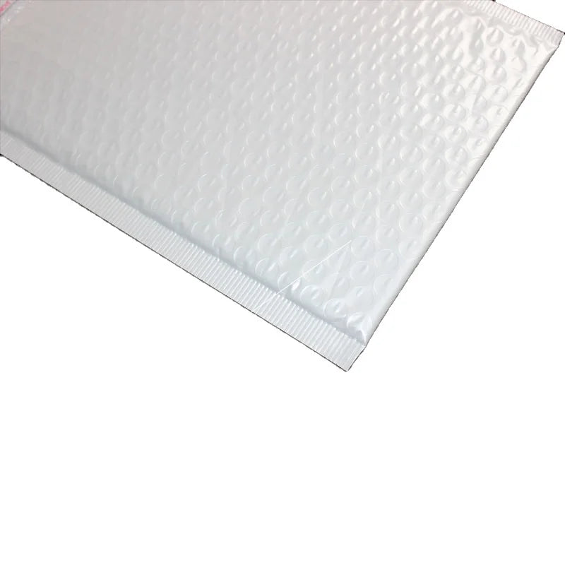 Close-up of white plastic bubble mailer with raised bubble texture and sealed edge