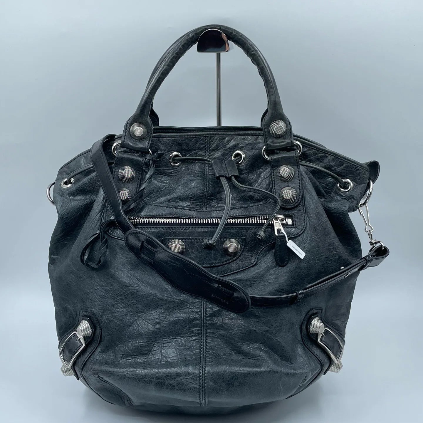Luxury Pre-Owned Designer Leather Bucket Bag with Chic Metal Studs and Adjustable Shoulder Strap