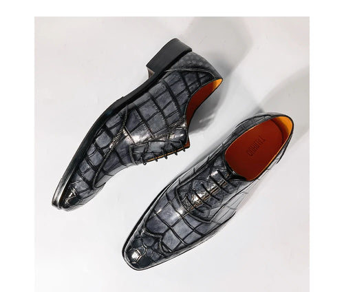 Luxury men's grey crocodile embossed leather lace-up dress shoes with a sleek black sole and gold-tone hardware.