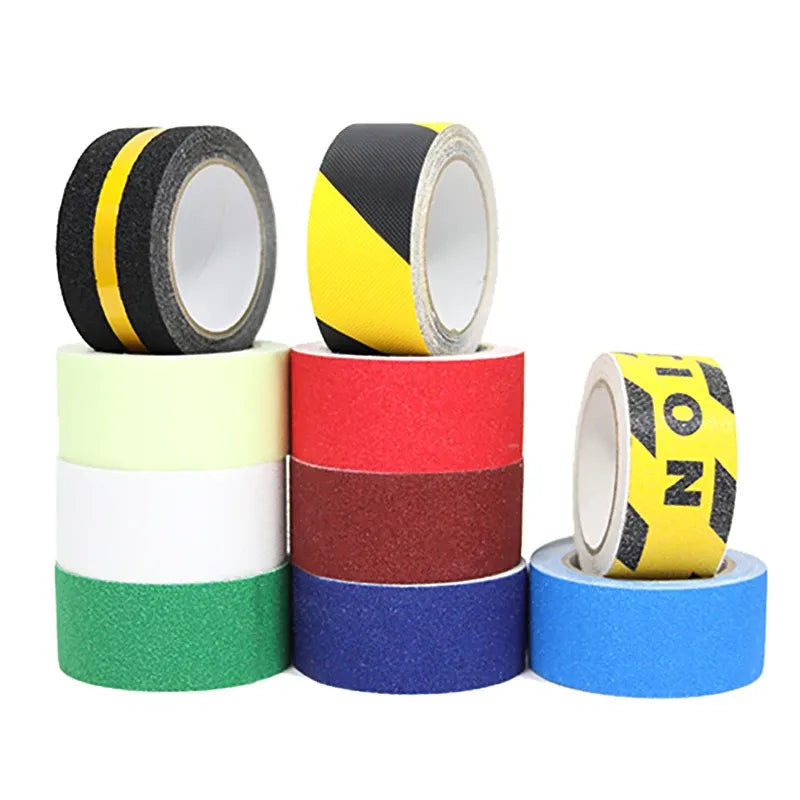 Stacked colorful non-slip tape rolls, including black and yellow accents