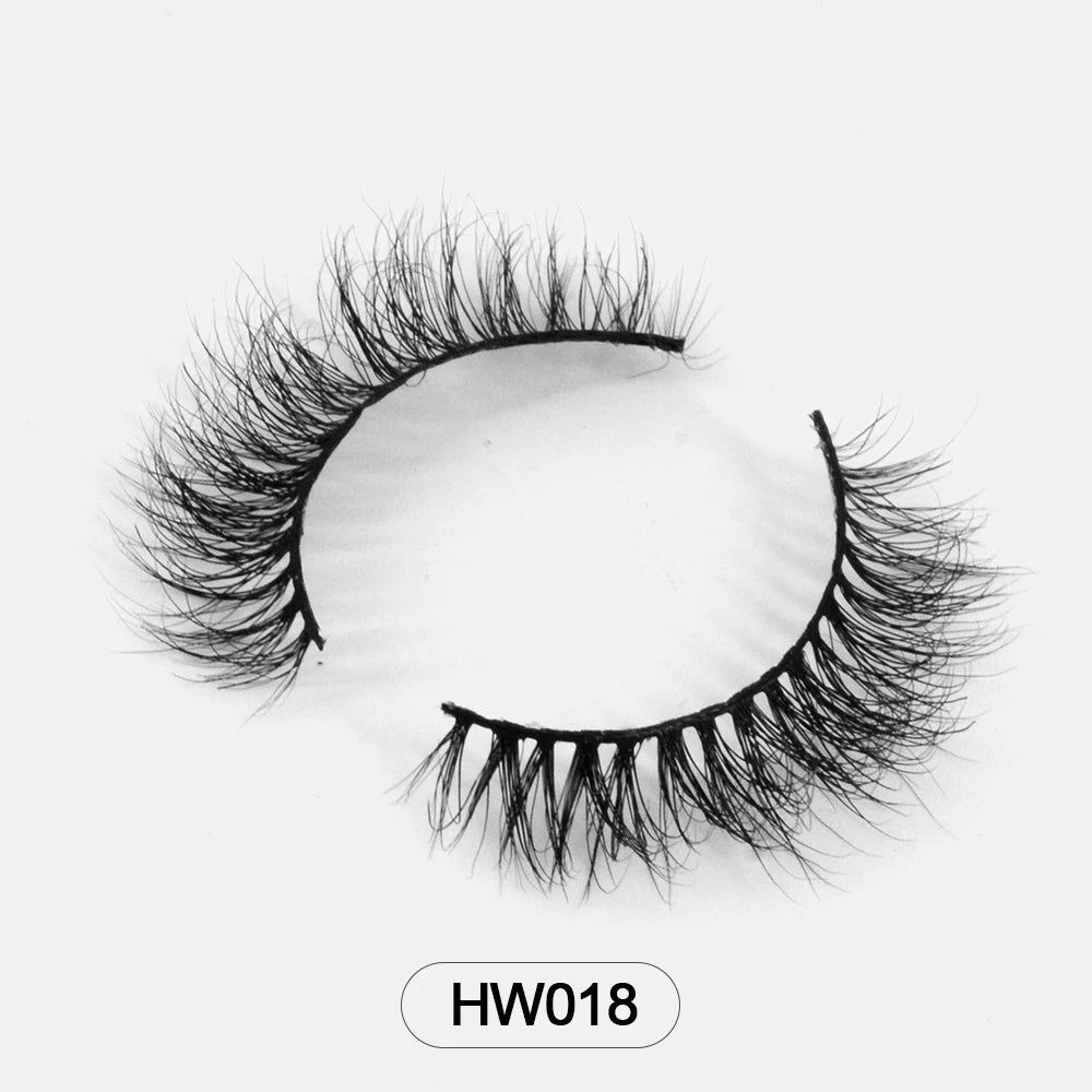 Black 3D mink false eyelashes with a soft, flared, wispy design and a flexible band, labeled HW018.
