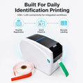 White label printer with black top cover and front label feed slot