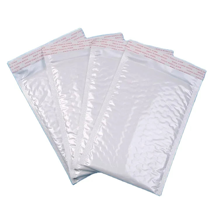 White plastic bubble mailer envelopes with printed red-and-blue strip on flap edge