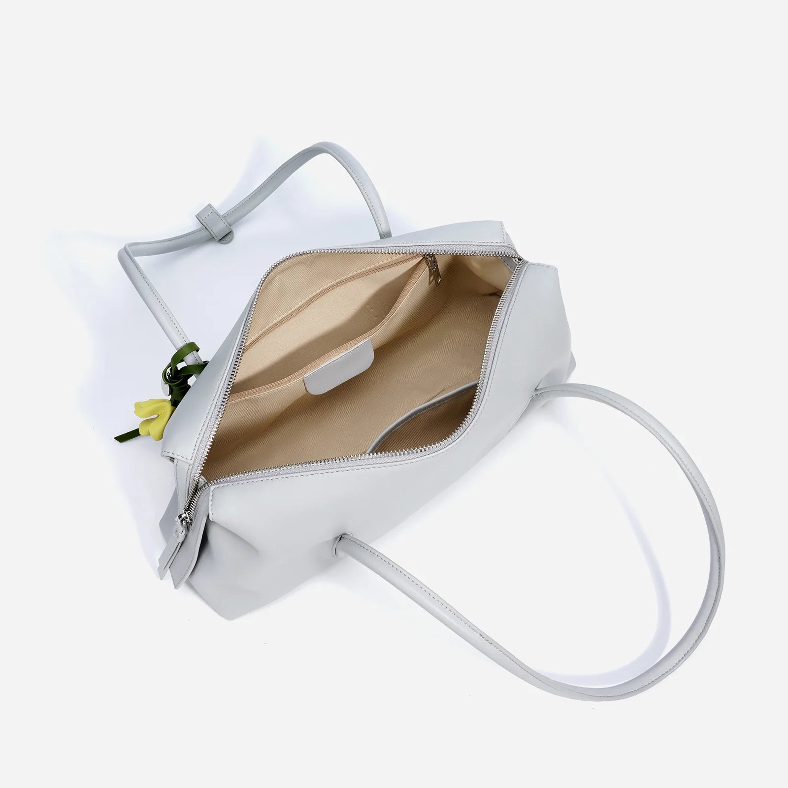 Grey genuine cowhide leather trunk handbag with top zipper, shoulder straps, and interior pockets.