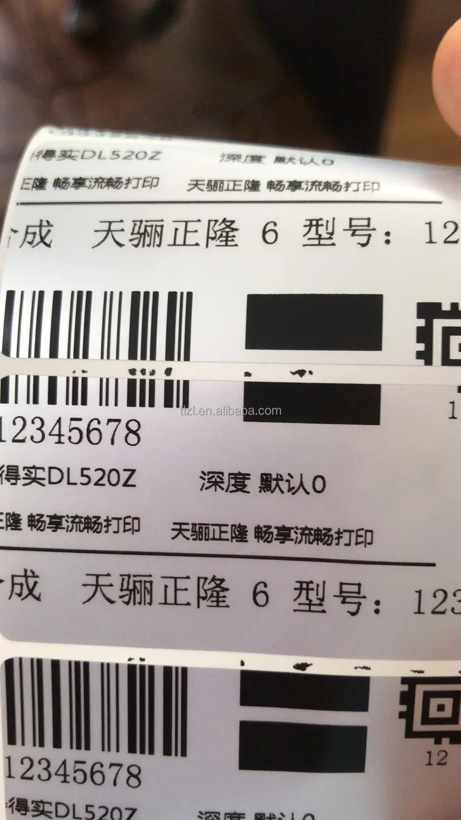 Close-up of printed barcode label strip with black square block