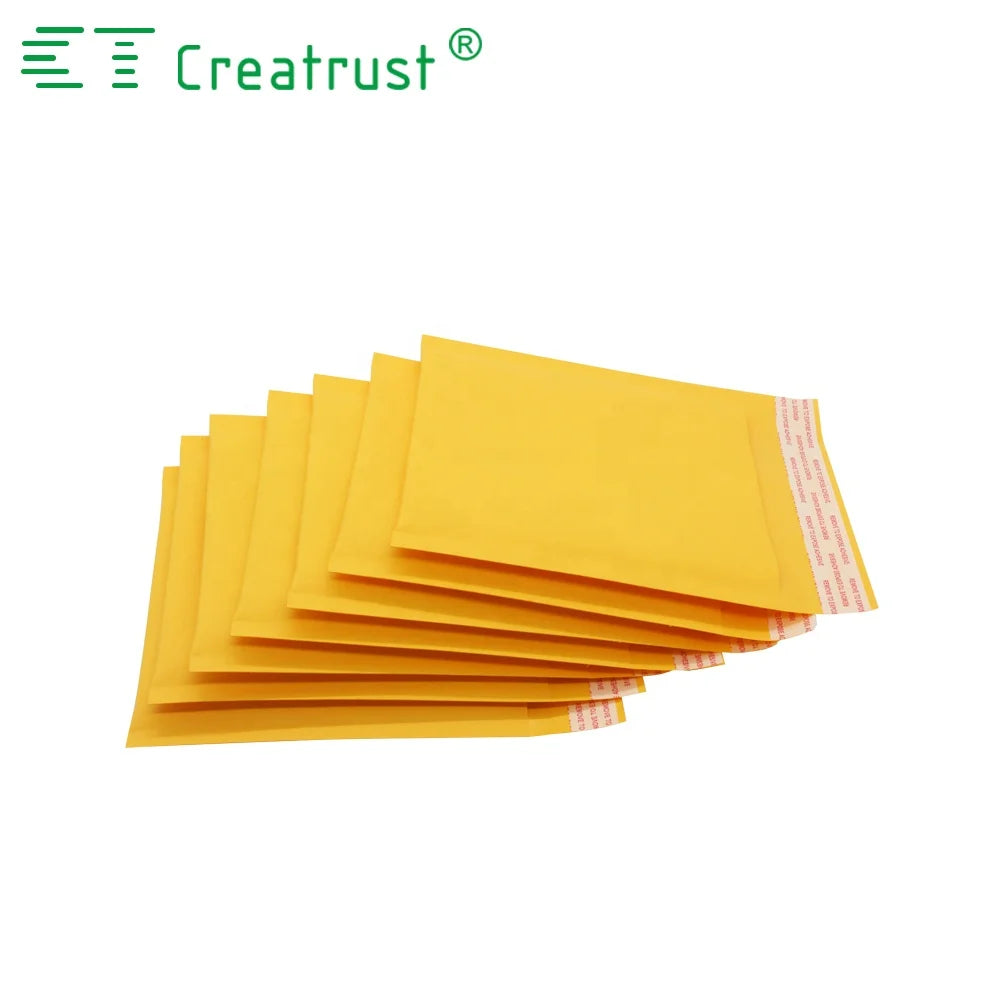 Stack of yellow padded mailing envelopes, showing multiple fold-over flaps