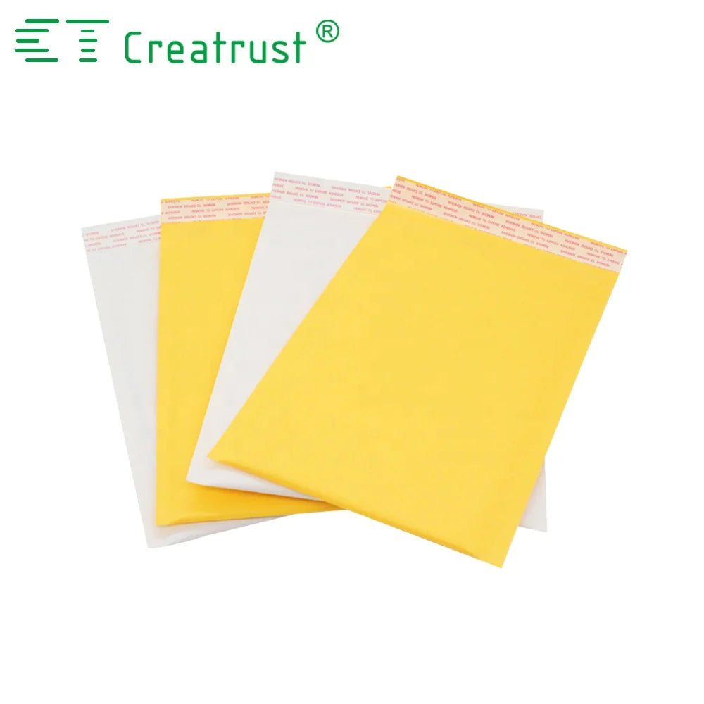 Yellow and white padded mailing envelopes stacked with fold-over flaps visible