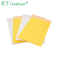 Stack of yellow padded mailer envelopes with red printed header strips on top