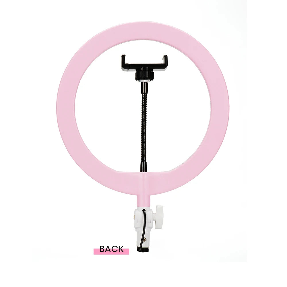 Pink ring light with an adjustable center phone holder on a flexible black arm, isolated on a white background.