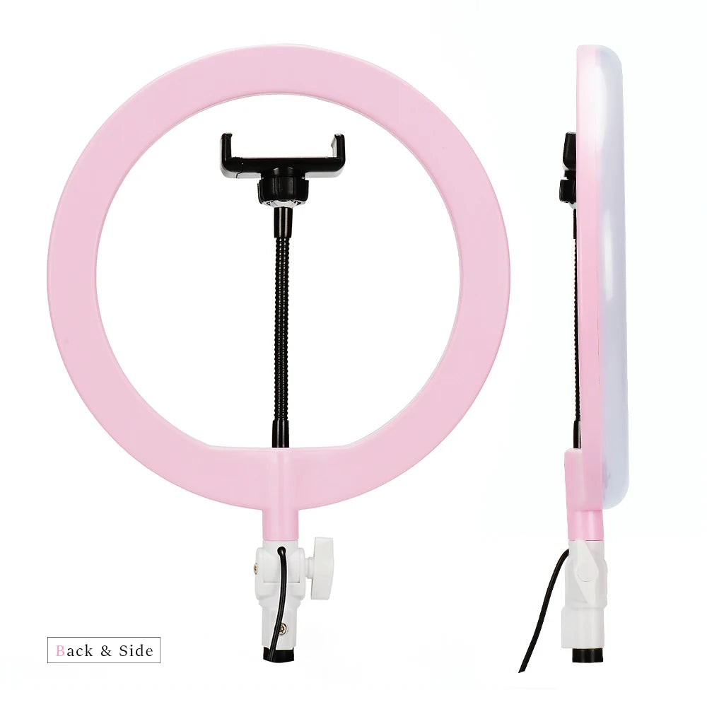 Pink circular ring light with a central adjustable smartphone mount for photography and video recording.
