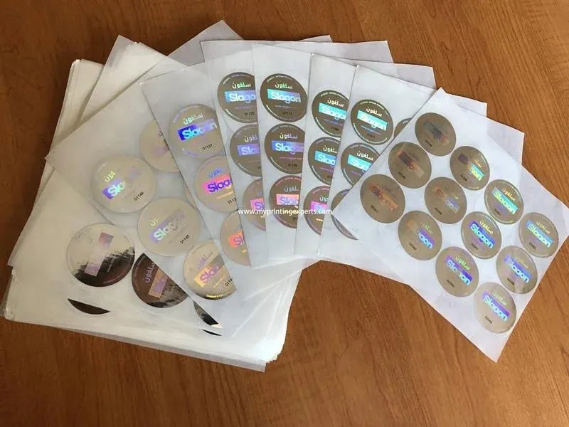 Pack of round holographic adhesive sticker sheets, overlapping with reflective circles