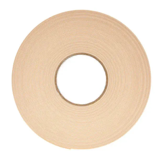 Tan foam mounting tape roll with center hole, double-sided adhesive strip