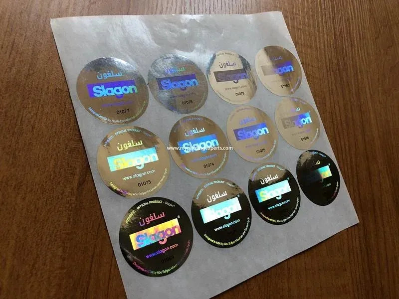 Round holographic adhesive stickers on PET sheet, light gold and black reflective circles