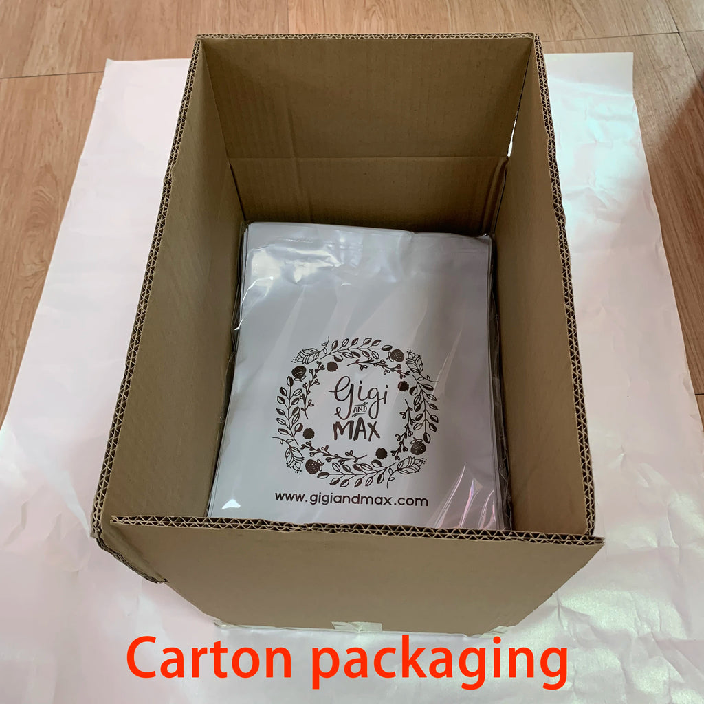 White poly mailer inside open cardboard shipping box