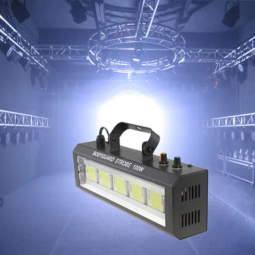 LED strobe light projector, black housing with handle, emitting bright white flash