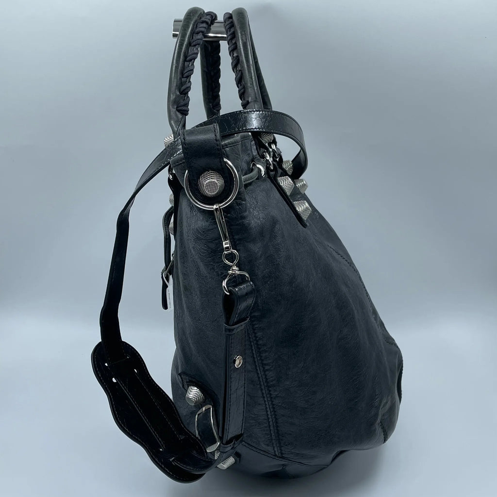 Luxury Pre-Owned Designer Leather Bucket Bag with Chic Metal Studs and Adjustable Shoulder Strap