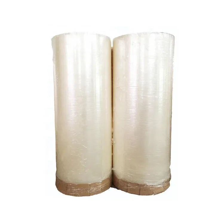 BOPP adhesive tape jumbo roll, transparent film with pale yellow tint, two rolls on cores
