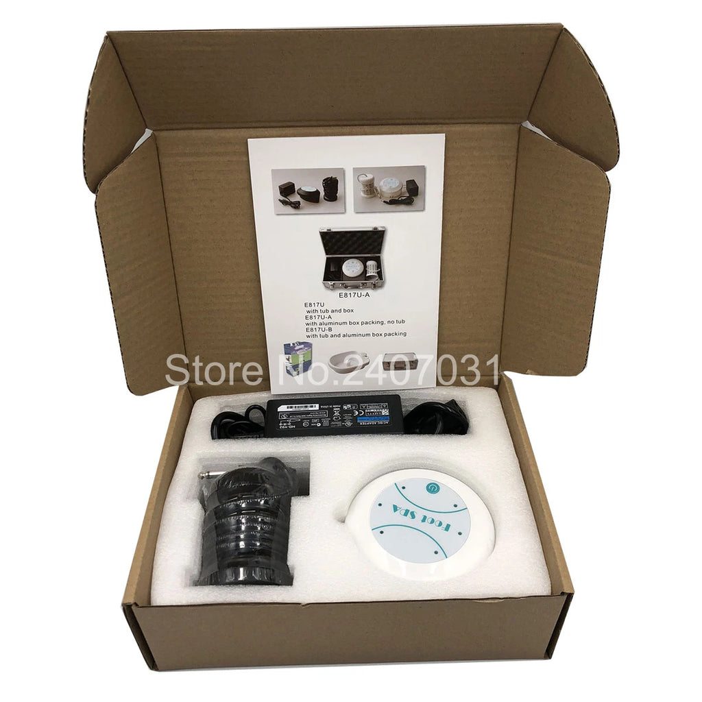 Ion detox foot spa machine set with power adapter and ionic array in protective cardboard packaging with user manual.